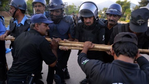 Pakistani riot police prepare for anti-government protests which have escalated since they began on August 15.