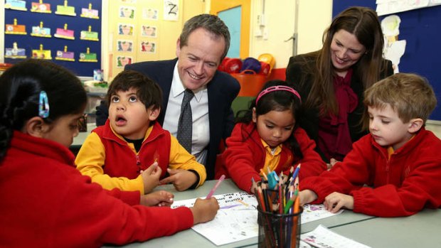 Opposition Leader Bill Shorten and Labor education spokesoman Kate Ellis at a Canberra primary school. Mr Shorten says Labor wants schools to be able to retain secular welfare workers using funds from the chaplains program.