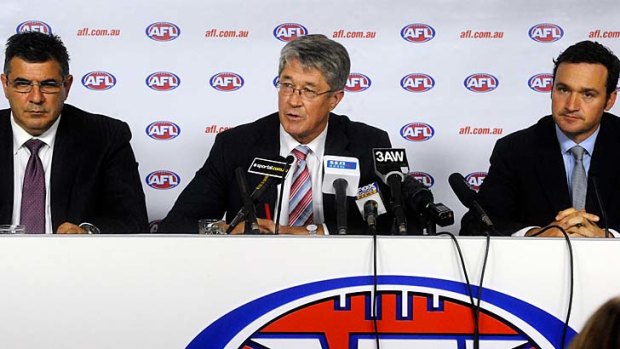 Grim news: AFL CEO Andrew Demetriou, Commissioner Mike Fitzpatrick and Football Operations Manager Adrian Anderson.