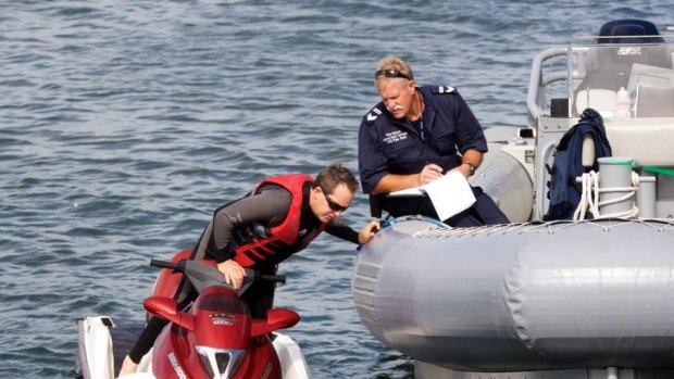 Water police carry out a safety and ID check with a jet-skier on Port Phillip Bay at the weekend.