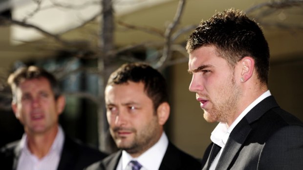 Josh Dugan speaks to the media outside court, with his solicitor Kamy Saeedi, centre, and Raiders CEO Don Furner.