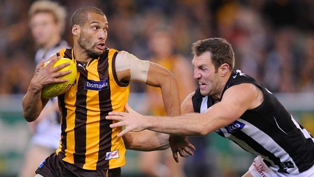 It's mine: Travis Cloke makes a desperate attempt to stop Josh Gibson from breaking free.