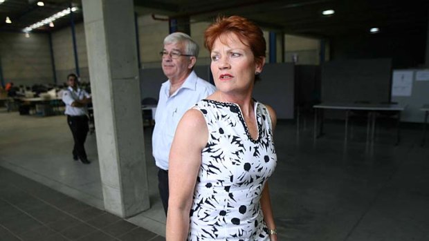 Close but no seat ...  Pauline Hanson leaves the counting centre at Riverwood yesterday, 1300 votes short of success.