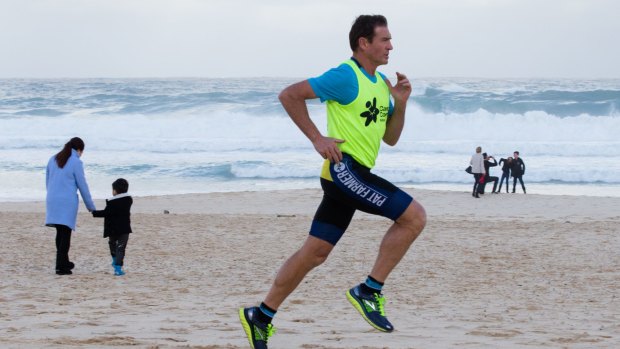 Pat Farmer runs on Bondi Beach, where Sunday's City2Surf will finish.