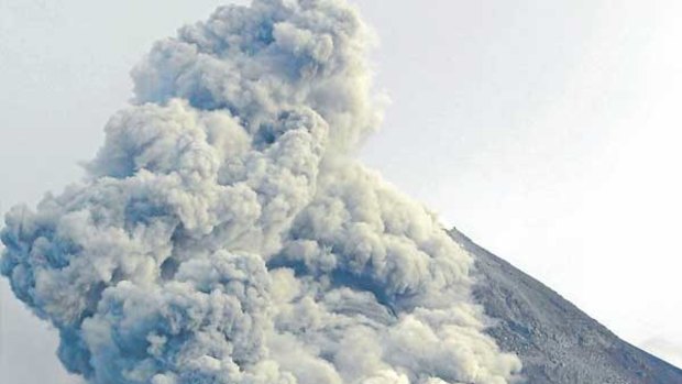 Mount Merapi spews earth, rock and gas, as seen from Yogyakarta yesterday.
