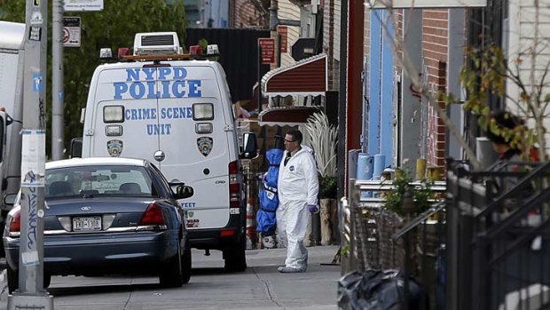 Crime scene personnel in Brooklyn, where a musician shot and killed two members of an Iranian indie rock band, the Yellow Dogs, and a third musician early Monday, and wounded a fourth person at their apartment before killing himself
