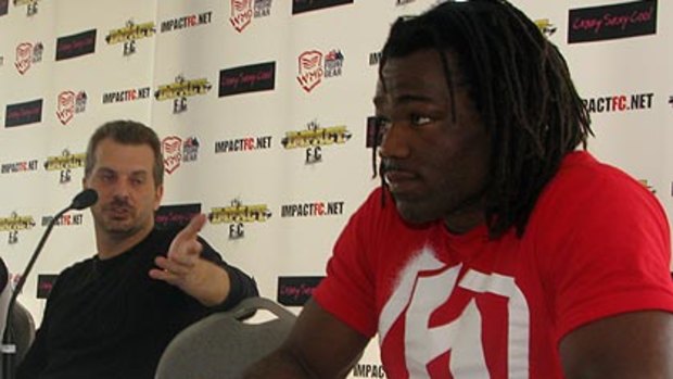 Promoter Tom Huggins and fighter Thierry Sokoudjou.