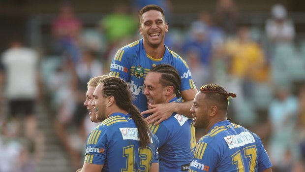 In-form: Corey Norman and Brad Takairangi of the Eels celebrate scoring a try.