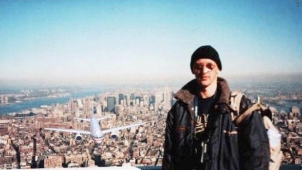 Hungarian man Péter Guzli posing on top of the World Trade Center as a hijacked plane approaches from behind. He added the plane as a joke.