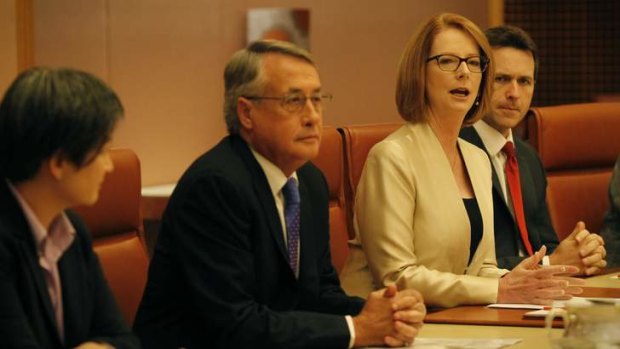 Prime Minister Julia Gillard at a ministerial meeting with Treasurer Wayne Swan, Senator Penny Wong and Home Affairs Minister Jason Clare.