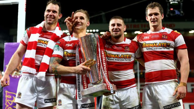 Another trophy: Pat Richards, Sam Tomkins, Michael McIlorum and Sean O'Loughlin celebrate Wigan's 30-16 victory over Warrington Wolves in the Super League grand final at Old Trafford last year.