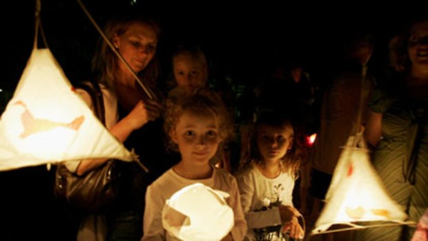 Children celebrate Earth Hour at Avalon Beach, Northern Beaches, Sydney.