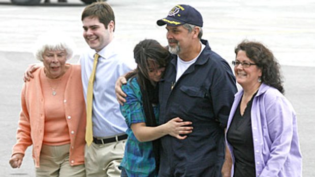 Captain Richard Phillips with his family following his return home on April 17. From left, his mother, Virginia; his son, Daniel; his daughter, Mariah Phillps; and his wife, Andrea.