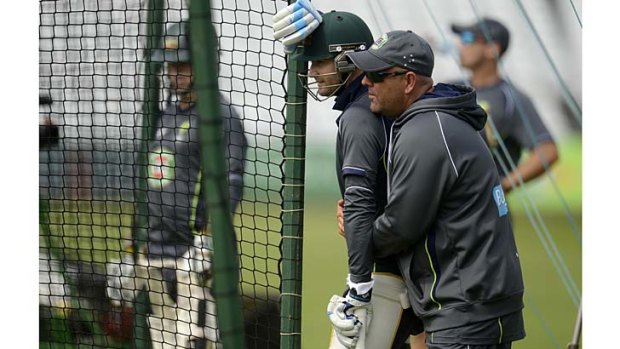 Michael Clarke is hugged by coach Darren Lehmann during a training session at Trent Bridge.