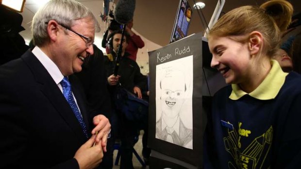 Muscling up to Rupert Murdoch: Prime Minister Kevin Rudd visits Langwarrin Park Primary School in south-east Melbourne.