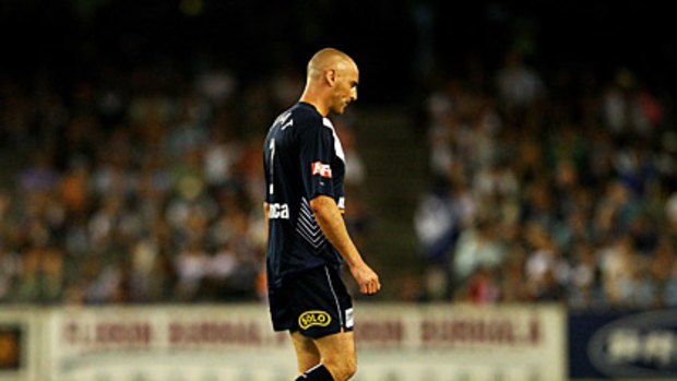 Lonely walk: Kevin Muscat leaves the field following his red card.