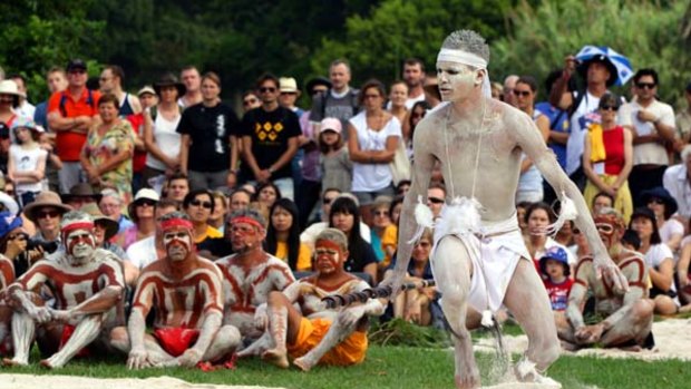 Coming together ... Aboriginal dancers perform a traditional Woggan-ma-gule (meeting of the waters)  ceremony to  honour the spirits of past inhabitants. The location, the Royal Botanic Gardens, is  an important  ceremonial site for the Gadigal people.