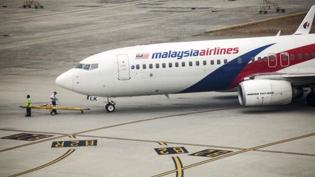 Flights continue ... A Boeing 737-800 aircraft operated by Malaysian Airlines is prepared for take off at Kuala Lumpur International Airport (KLIA) in Sepang, Malaysia.