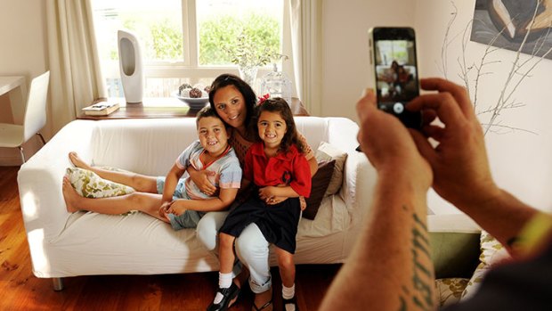 Dad Sean takes a happy snap of Tiarni, mum Rose and brother Aiden ahead of Tiarni's first day of kindergarten.