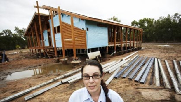 Uninsured... Mia Paulsen waits nervously to learn the future of dream home, destroyed by floods while still under construction.