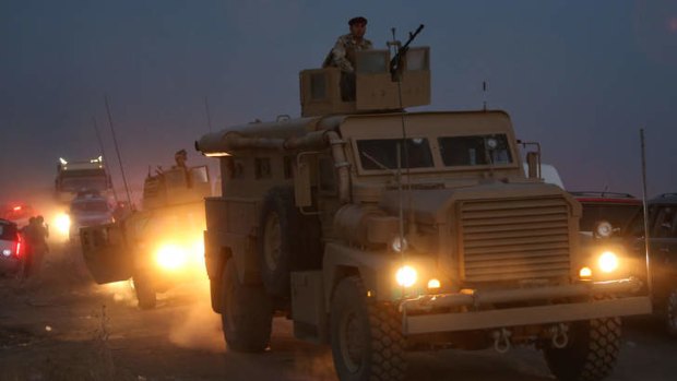 Violence engulfs Iraq: Kurdish Peshmerga fighters on their military vehicles.