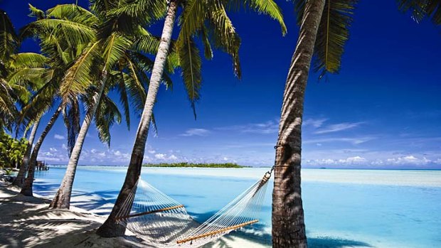 Picture perfect ... Aitutaki's lagoon is dotted with small islands.