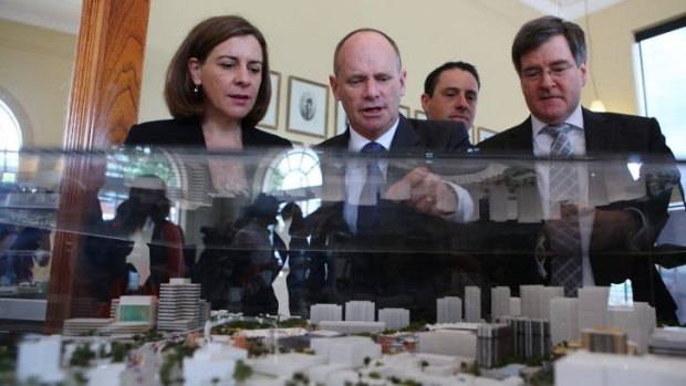 Queensland Premier Campbell Newman inspects the plans for Brisbane's showgrounds.