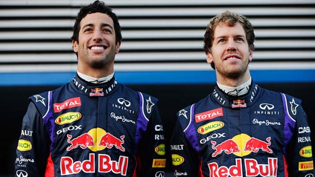 The Red Bull drivers for 2014, Daniel Ricciardo of Australia and Sebastian Vettel of Germany, pose for photographers at the launch of their new car at the Circuito de Jerez on Tuesday.
