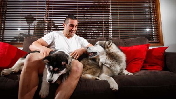 Raiders prop Paul Vaughan relaxes at home with his two dogs, Diesel and Mika.