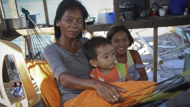 Thelma Fevidel and her children returned to rebuild their small home, despite being in a no-build zone in Tacloban.