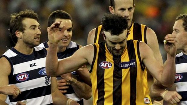 Rivals: Jordan Lewis tangles with the Cats in last year's finals.