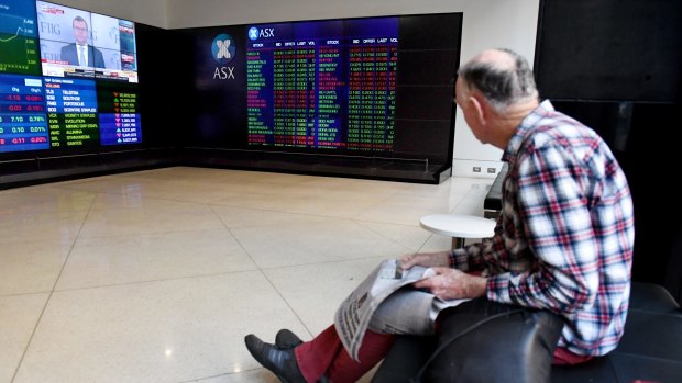 How much longer can the bull run contuinue? An investor watching the stock board at the ASX.
