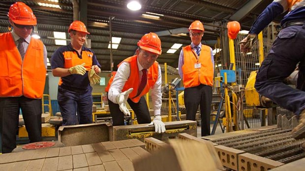 High visibility: As opposition leader in 2011, Tony Abbott warned this Sydney brick manufacturer it would lose $2 million a year through the carbon tax.