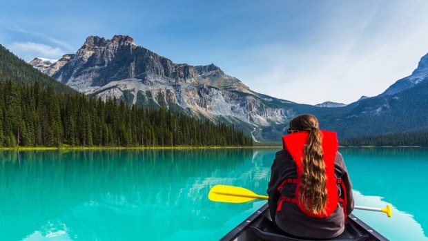 Canoeing on Emerald Lake in summer at Yoho National Park. 