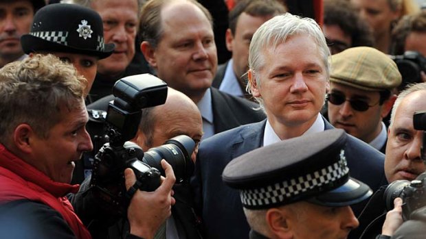 WikiLeaks founder Julian Assange arrives at London's High Court earlier today.