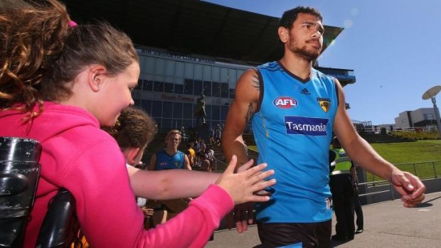 Cyril Rioli is greeted by fans during a media session at Waverley Park.