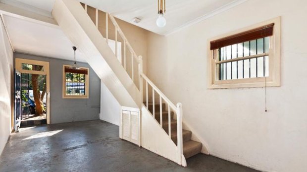 This unrenovated two-bedroom terrace on a tiny 69 sq m block in Redfern sold for $821,000.