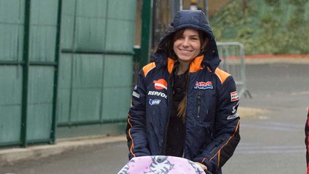 Close family ... Casey Stoner's wife walks with their daughter.