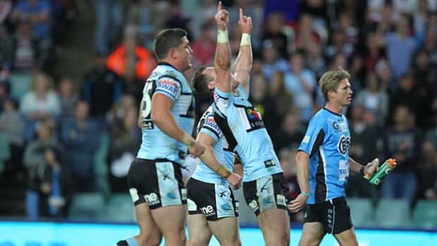 Cronulla players celebrate after defeating North Queensland on Saturday.