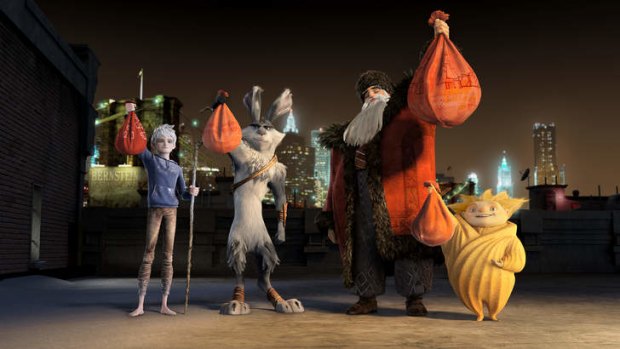Jack Frost (Chris Pine), Bunnymund (Hugh Jackman), North (Alec Baldwin) and Sandman show off their holiday loot in DreamWorks' Rise of the Guardians.