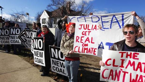 Protesters respond to Prime Minister Julia Gillard's citizens assembly on climate change.