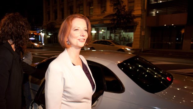 Taking it on the chin  ...   Julia Gillard defended the carbon tax yesterday in Brisbane.
