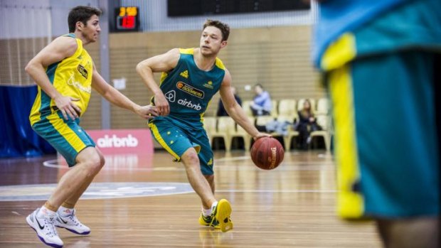 Matthew Dellavedova, right, is guarded by Damien Martin at the Australian Boomers training camp at the AIS on Thursday.