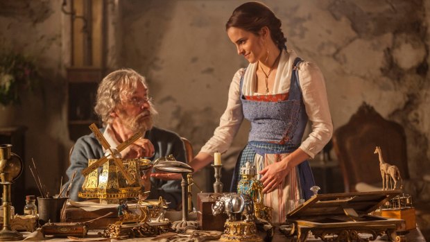 Emma Watson as Belle, right, and Kevin Kline as Maurice in <i>Beauty and the Beast</i>.