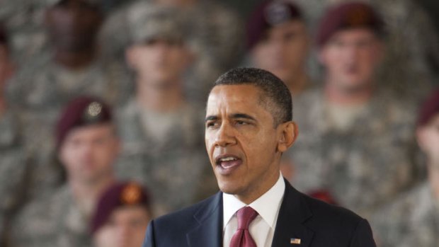 Paying tribute ...US President Barack Obama hails US troops.