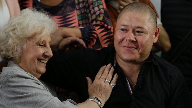Estela de Carlotto, from Grandmothers of the Plaza de Mayo, greets Mario Bravo during a press conference to announce the identification of the man who as a child was taken from his mother during the military dictatorship.