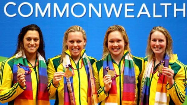 Blair Evans, Meagen Nay, Kylie Palmer and Bronte Barratt celebrate gold for Australia in the Women's 4x200m Freestyle Final.