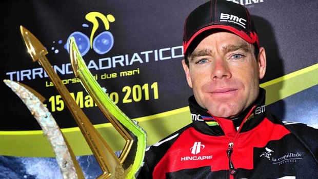Cadel Evans poses with his trophy after winning the Tirreno-Adriatico race.