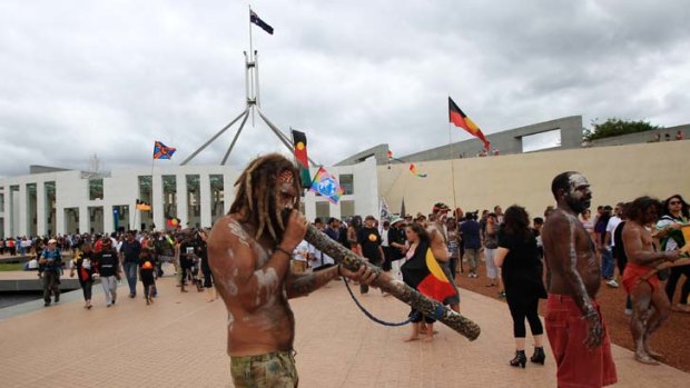Protesters from the Aboriginal tent embassy on the forecourt of Parliament House in Canberra today.