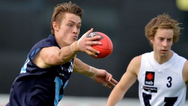 Darcy Moore (left) in action for Vic Metro against Vic Country in May.